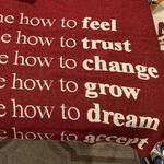 A thumbnail of a red blanket with white text, reading "How to feel, change, grow, dream, accept..."